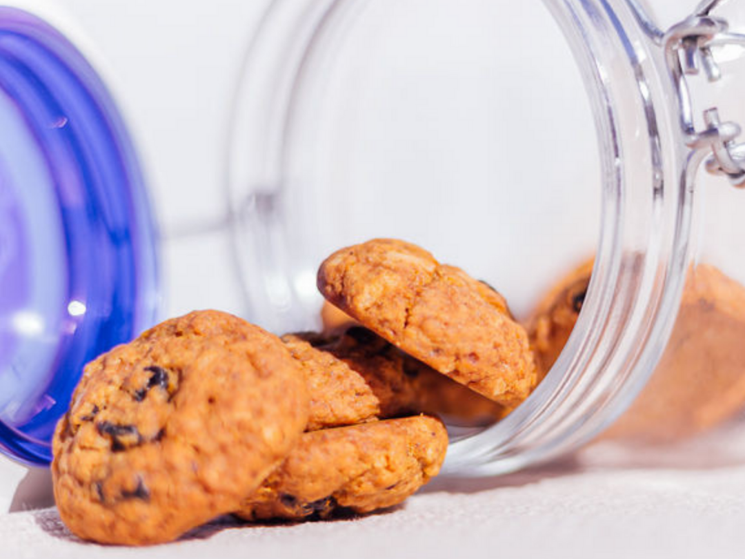 Wisefoods Health Star rated cookies spilling out of an upturned cookie jar
