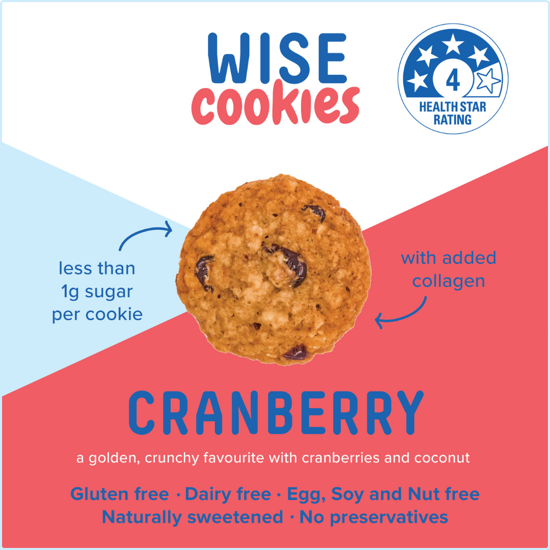 Wisefoods | 240g Glass Gift jar of 4.0 Health Star rated, allergy-friendly, collagen Cranberry Wise Cookies with a stack of cookies on the right and a hand holding one cookie between thumb and forefinger above that