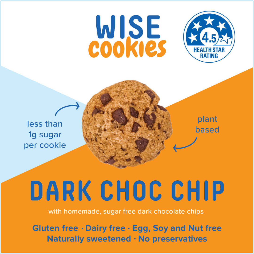 Wisefoods | 4.5 Health Star rated, allergy-friendly, plant based Dark Choc Chip Wise Cookies in a glass jar with a stack of loose cookies and a hand holding one between thumb and forefinger to the right of the jar