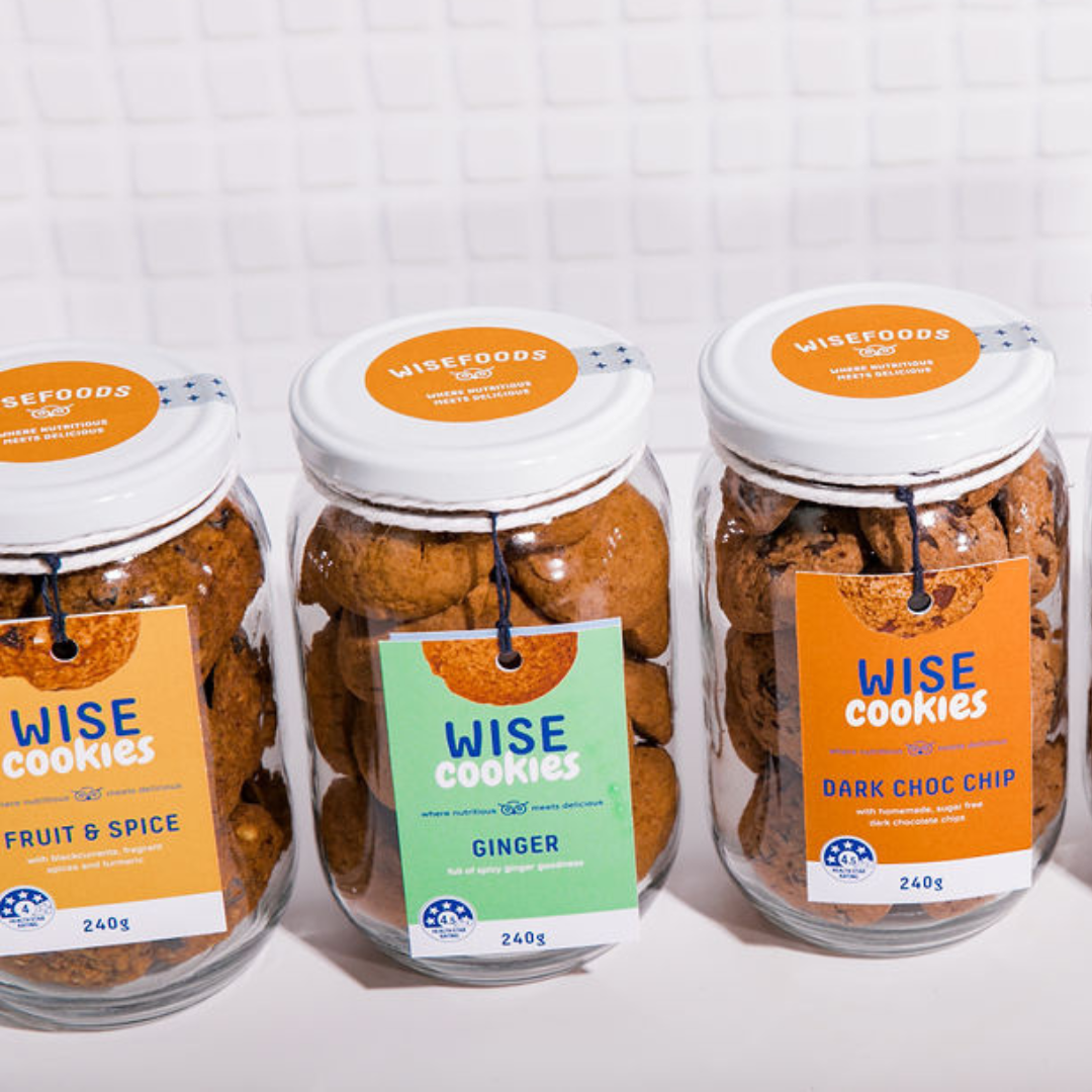 Wisefoods | A row of three 240g glass Gift jars of 4.0 &amp; 4.5 Health Star rated, allergy-friendly, low sugar Wise Cookies - from left to right, Fruit &amp; Spice, Ginger, and Dark Choc Chip
